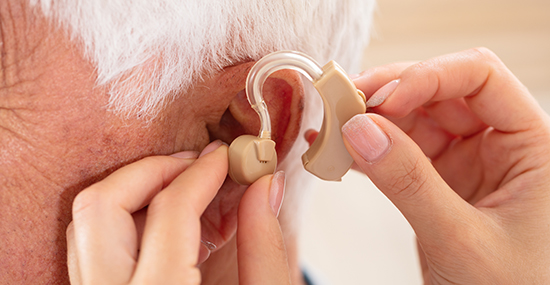 Audiology Hearing aid implanted on patient